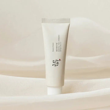 Tube of cream on a soft beige background
