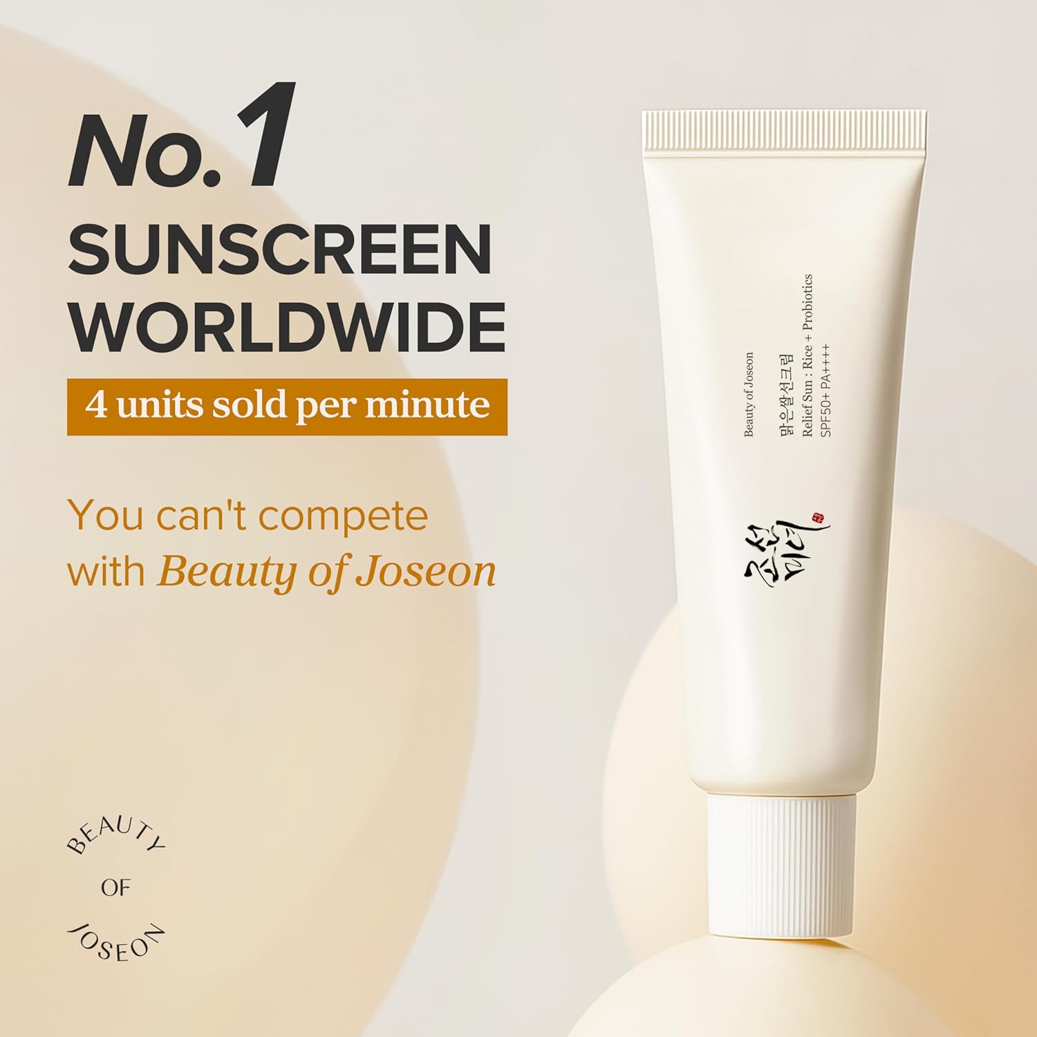 Beauty of Joseon sunscreen tube with promotional text on a light background